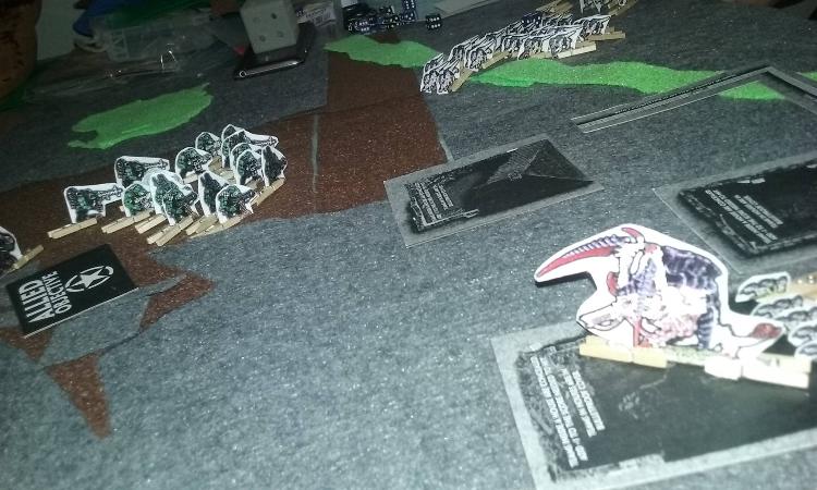 The Kan lumbers into cover, preparing for its inevitable duel with the Hive Tyrant. Shootas open up on the herd of Termagants as it pushes across the bridge.